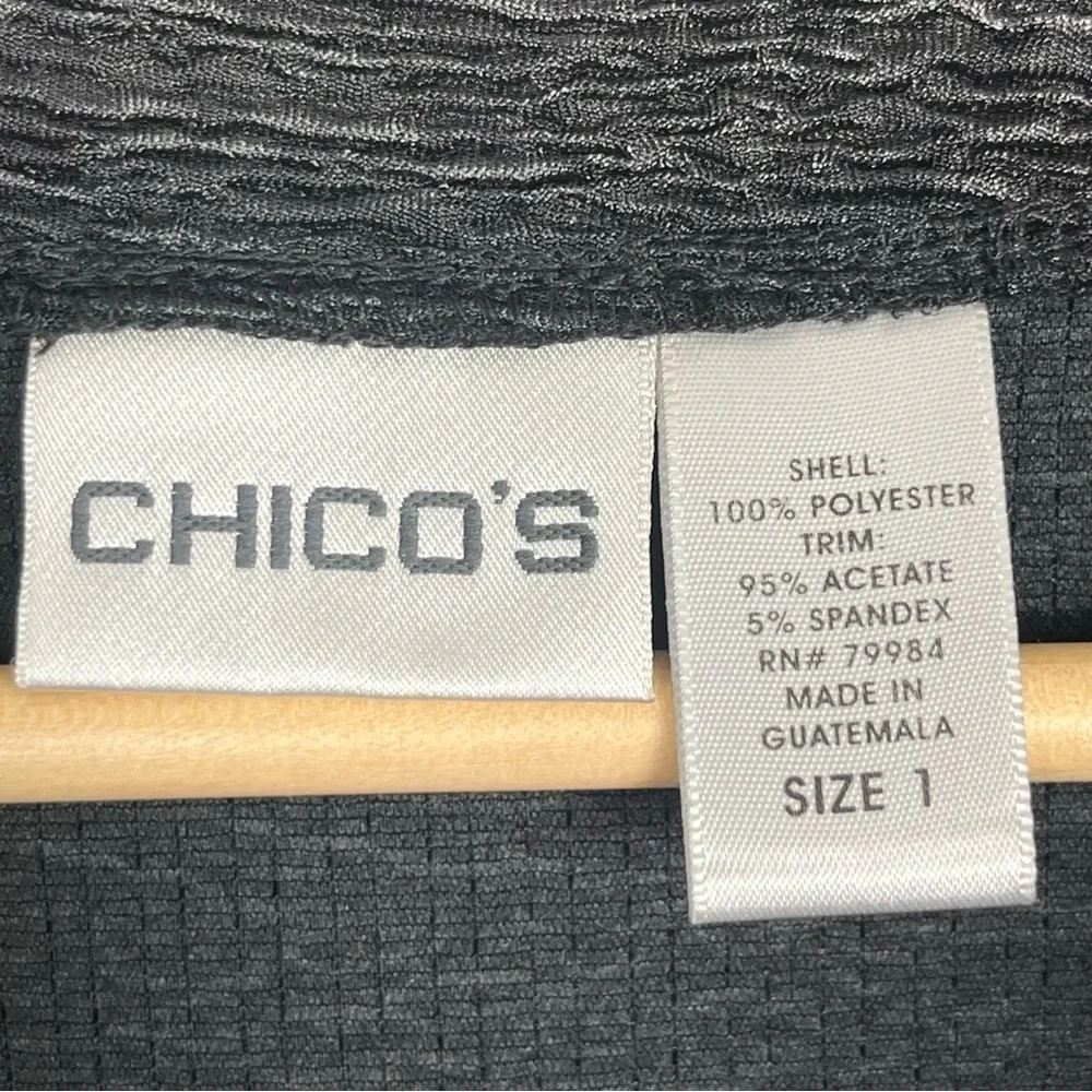Chico’s black textured ruffled shawl collar single hook closure jacket, medium.